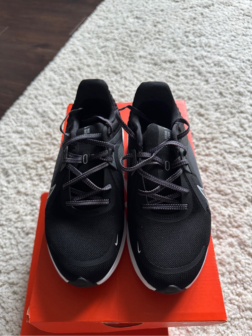 Nike women’s  Black Athletic Running Shoes with White Accents